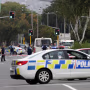 Image: Police stand outside a mosque in Linwood, Christchurch, New Zealand, Friday, March 15, 2019. Multiple people were killed during shootings at two mosques full of people attending Friday prayers