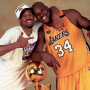 Image: Kobe Bryant and Shaquille O'Neal of the Los Angeles Lakers pose with the NBA Championship trophy at the Staples Center in 2000.