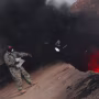 Image: An equipment manager tosses unserviceable uniform items into a burn pit in Iraq on March 10, 2008.