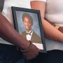 Nolan Wells photo frame is being held by his mother and step father.