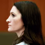 Side profile of Lindsay Clancy sitting inside of a court room