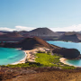 View on the volcanic landscape of Bartolome Island with famous Pinnacle Rock and Golden Beach, Galapagos Islands, Ecuador