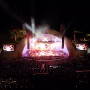 A wide view of the Hollywood Bowl from the back of the crowd at night.