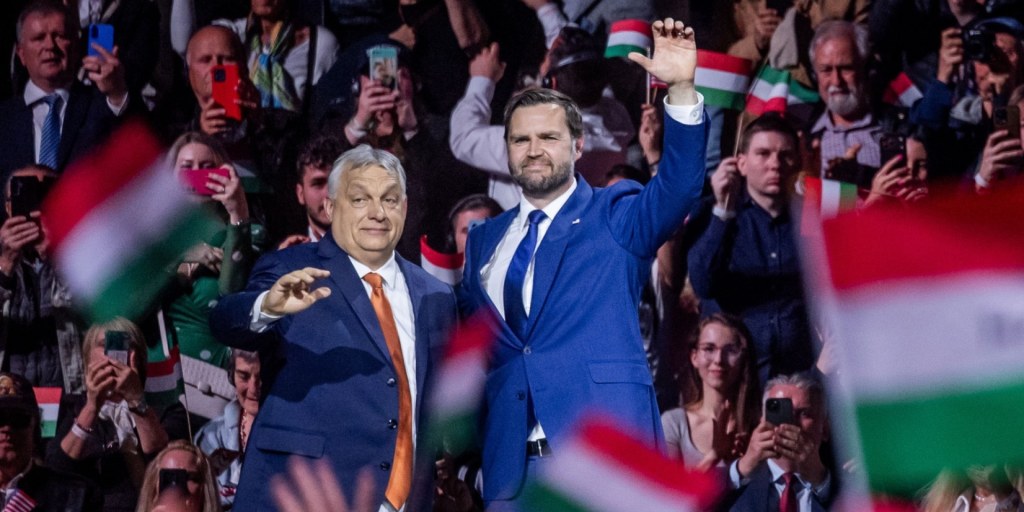 J.D. Vance smiles in Hungary, presumably taking notes on how to turn ‘illiberal democracy’ into a Made in USA product line.