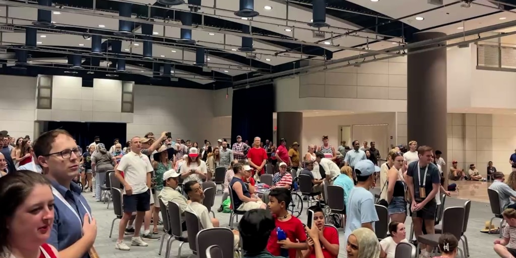 Watch: Salute to America event evacuees sing National Anthem