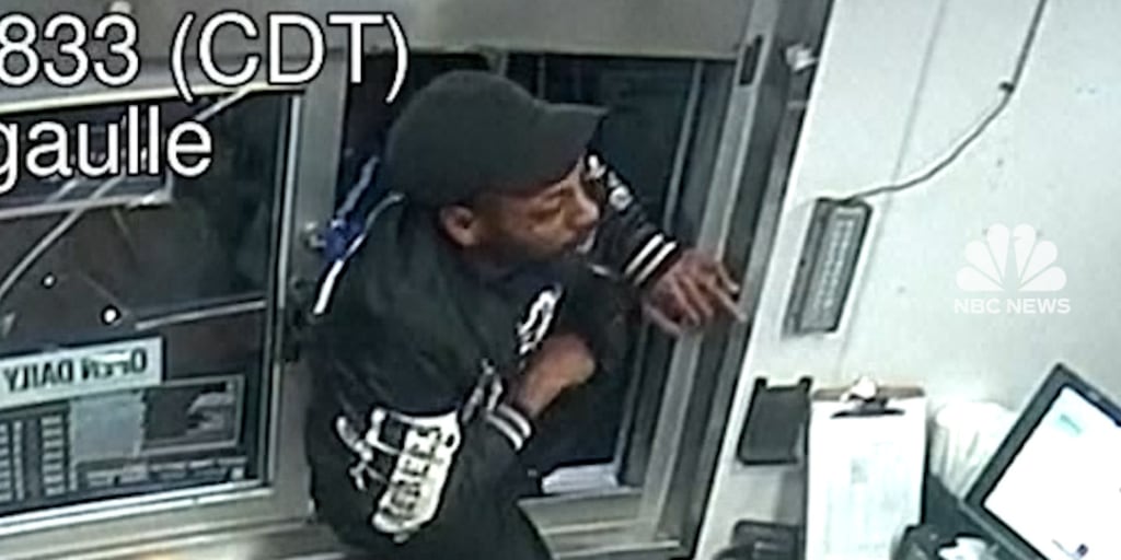 Man climbs through Taco Bell drive-thru with a gun