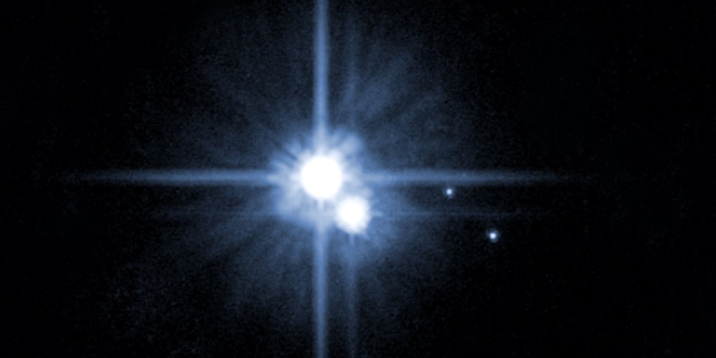 061121_pluto_vmed_3p.jpg