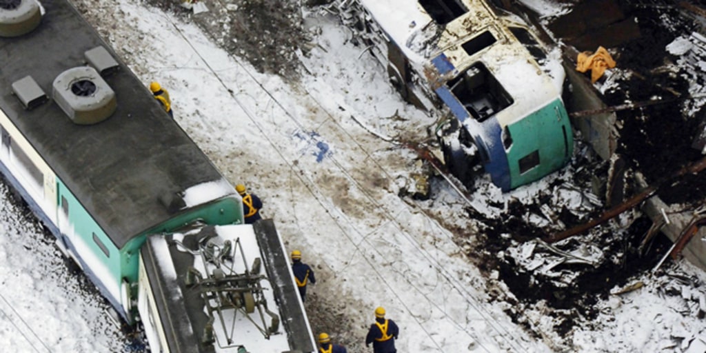 Officials look for clues in Japan train wreck