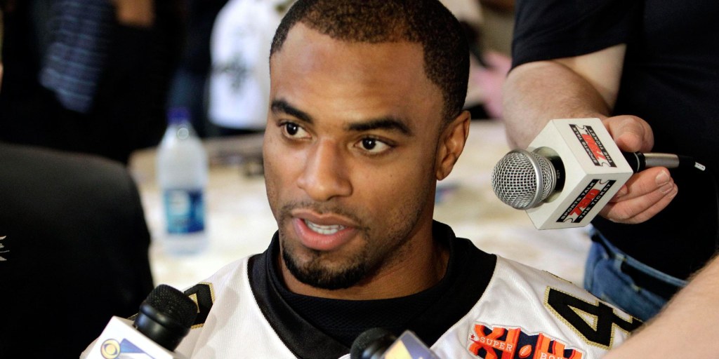 Ex-NFL Star Sharper Surrenders to Police on Rape Charges