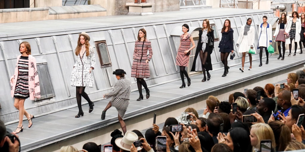 Gigi Hadid intercepts runway during Chanel's Paris Fashion show