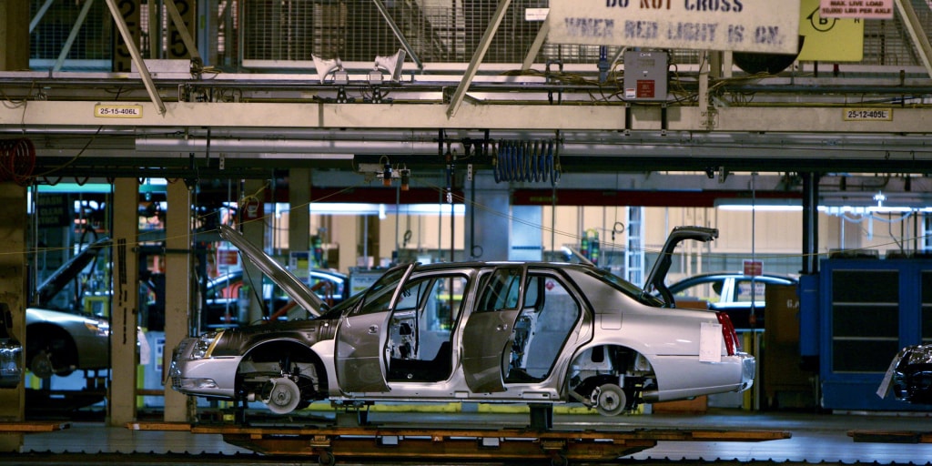 Automaker employees who work shoulder to shoulder say plants should have  closed earlier
