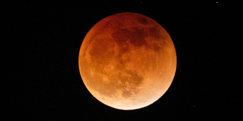 'Blood moon' puts on lunar display across parts of Americas, Europe and Africa