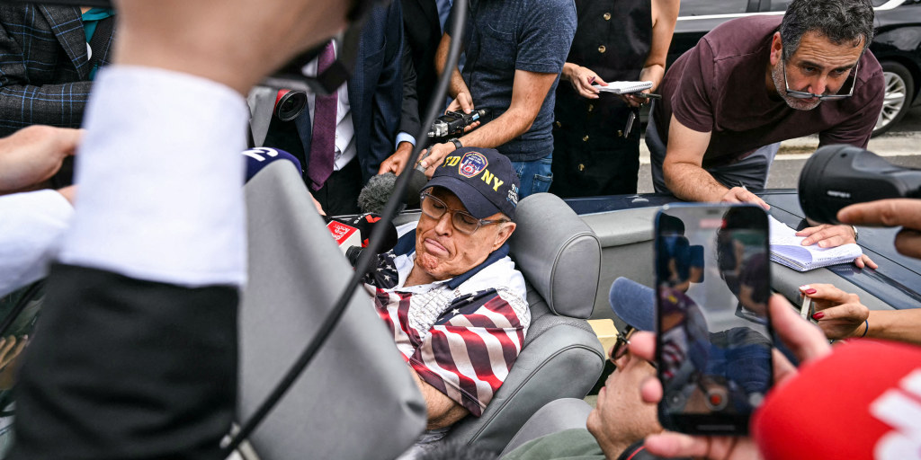 Rudy Giuliani shows up to vote in the Mercedes he was ordered to surrender