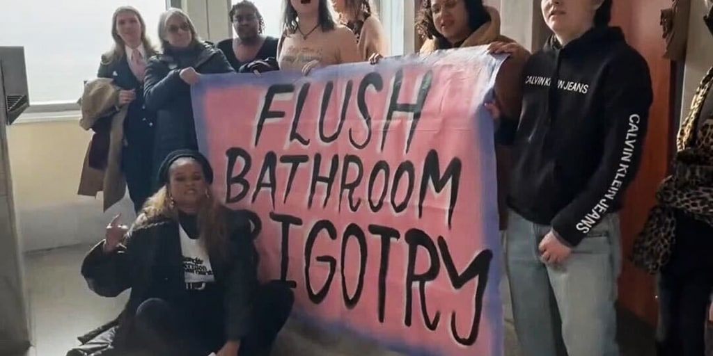 Transgender advocates stage a sit-in protest at a U.S. Capitol bathroom