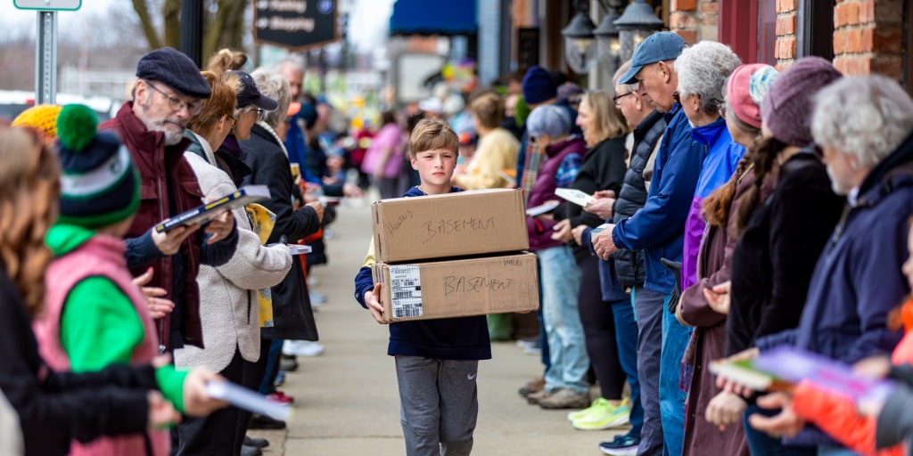 A Michigan community takes a novel approach to moving 9,100 books for shop's next chapter