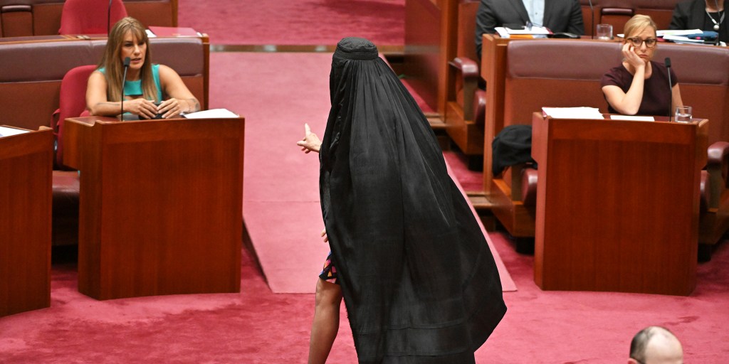 Australian senator is barred from Parliament for wearing burqa in protest