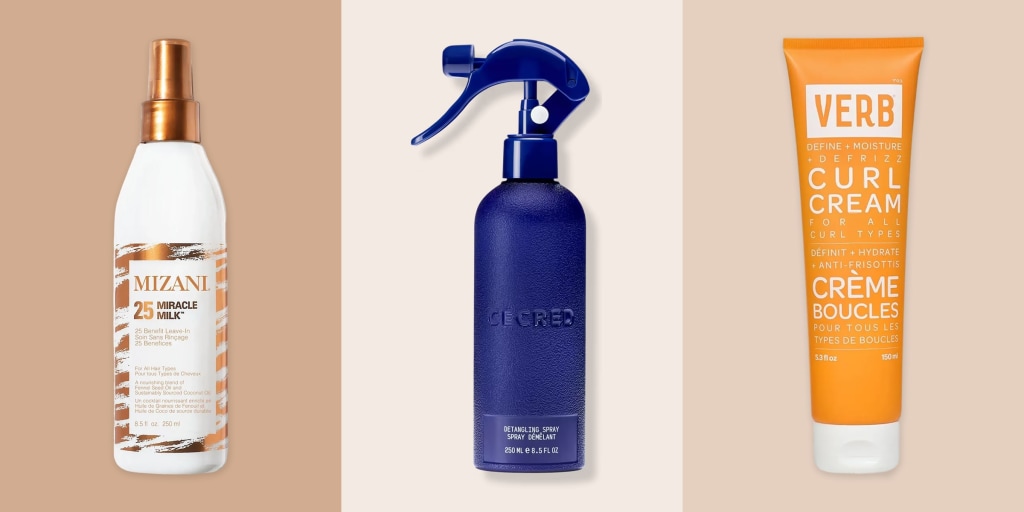 A person styling natural curls with product