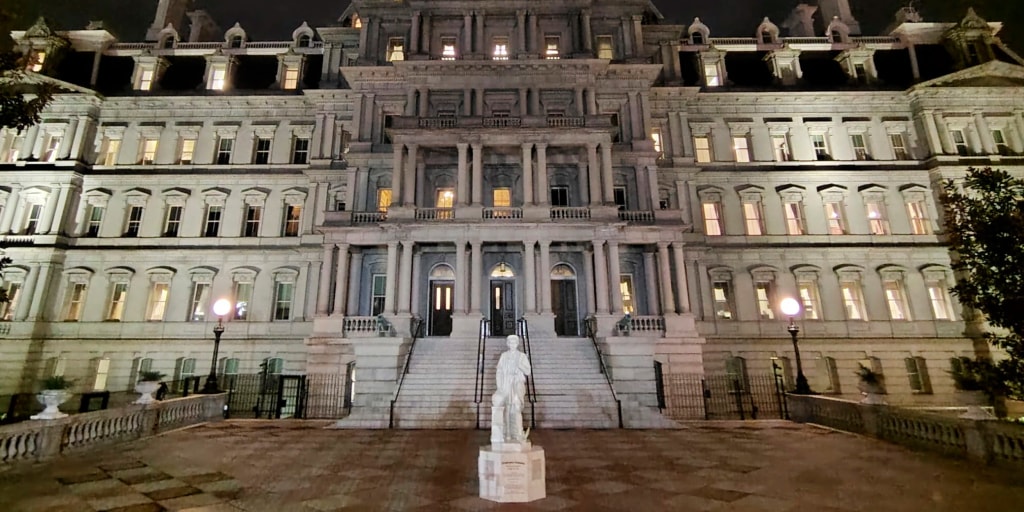 Contractors carefully install a marble tribute to genocide so it can "peacefully shine" under taxpayer-funded security, unlike the people it commemorates.
