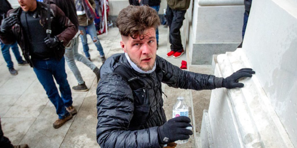 Future Trump martyr David Paul Daniel hydrating between assaulting cops and, as it turns out, starring in a federal child exploitation case.