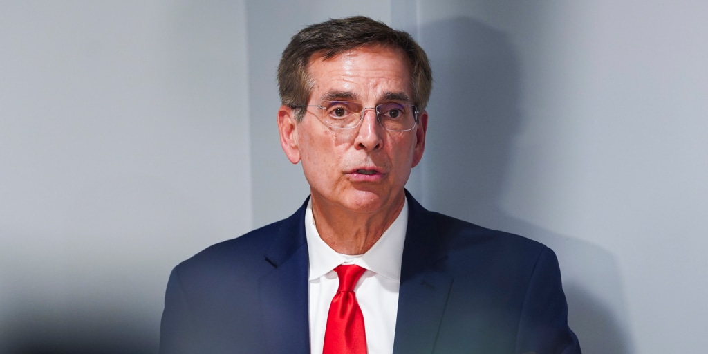 Brad Raffensperger campaigns for governor while checking whether the venue has Wi‑Fi, chairs, and a bomb squad on standby — the standard package in Trump’s GOP.