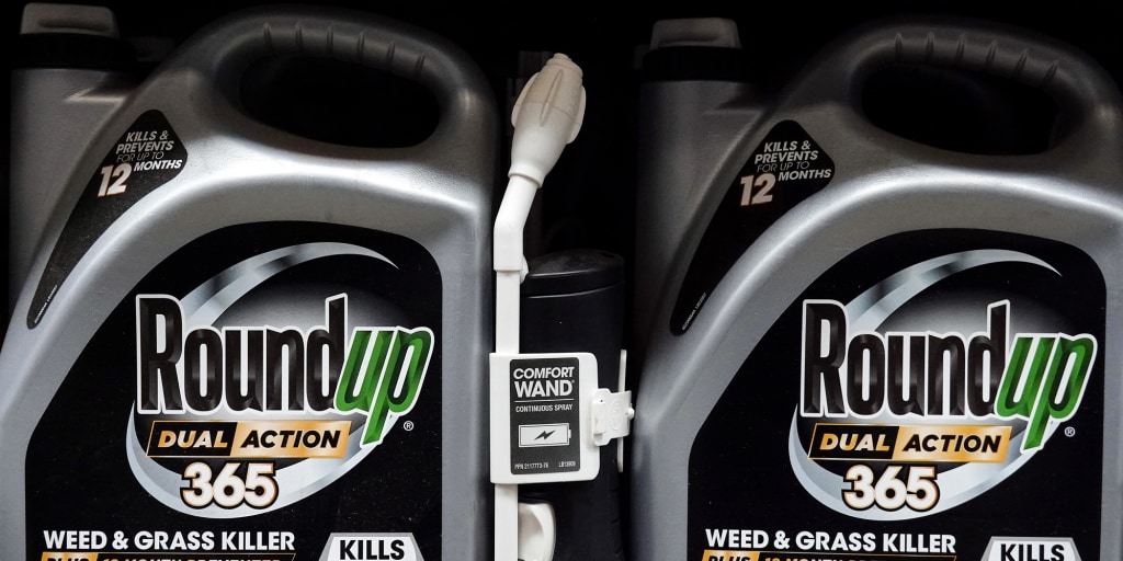 Roundup on the shelf at Lowe’s, proudly labeled with everything except the part about your white blood cells quitting their job.