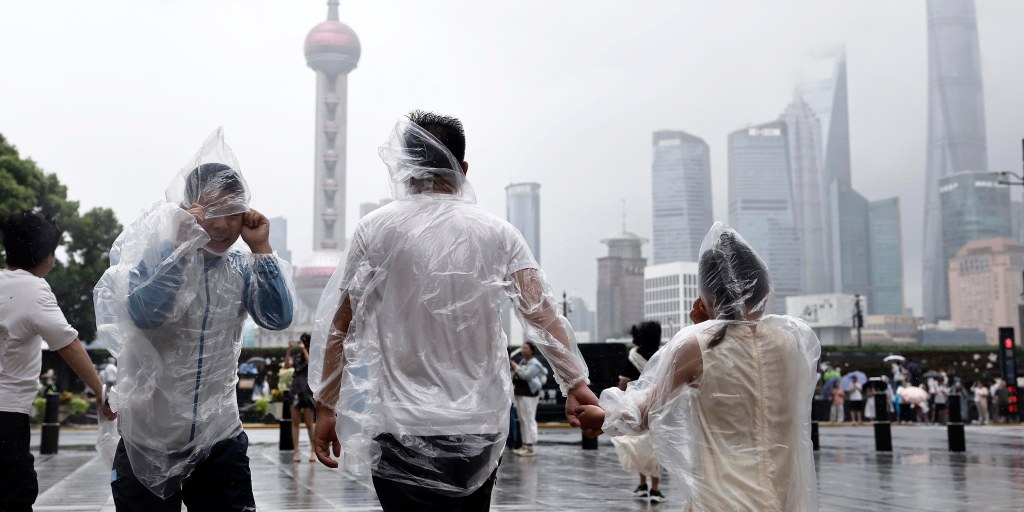 Torrential rain and storms in Typhoon Dolphin‘s wake sweep through several provinces in China’s east, drenching the coastal region and flooding streets in Shang