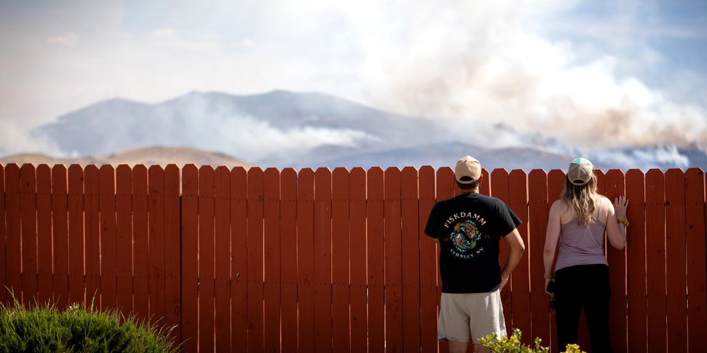 Fast-moving wildfire amid shifting winds threatens Reno, Nevada, forcing thousands to evacuate