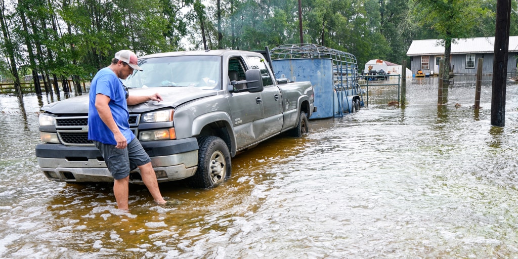 Texas authorities rescue dozens of people from stranded cars, homes surrounded by floodwaters and an assisted living facility as former Tropical Storm Edouard lingers over rural parts of the state and dumps nearly 2 feet of rain in some places.