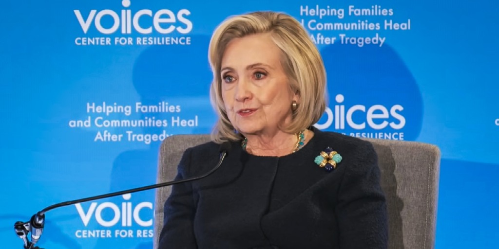 Hillary Clinton awkwardly attempting to explain that you cannot, in fact, deter terrorism with a ballroom and a vibes-based intelligence strategy.