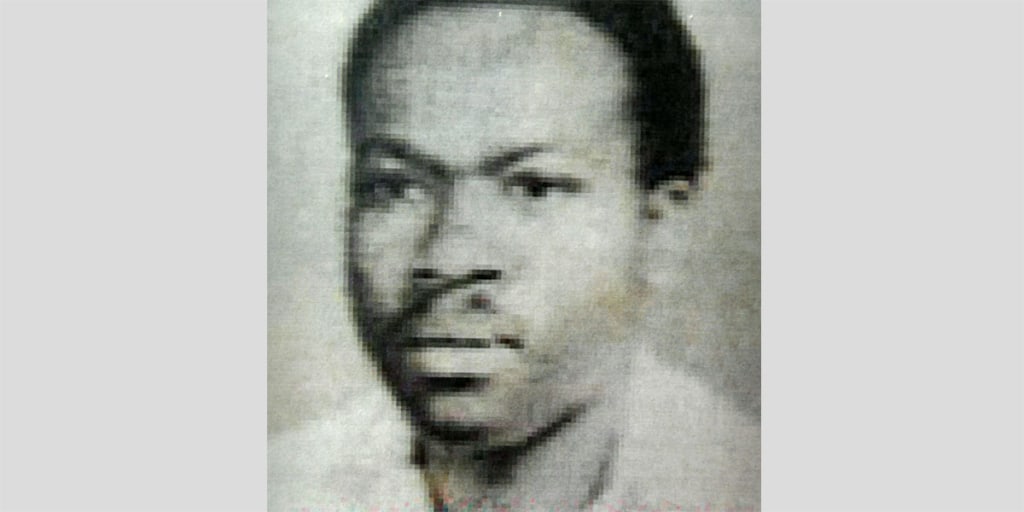 A doctor from Rwanda was arrested in London and charged with crimes related to the 1994 Rwandan genocide, British authorities say, making him the first person to be charged for taking part in the ethnic genocide.