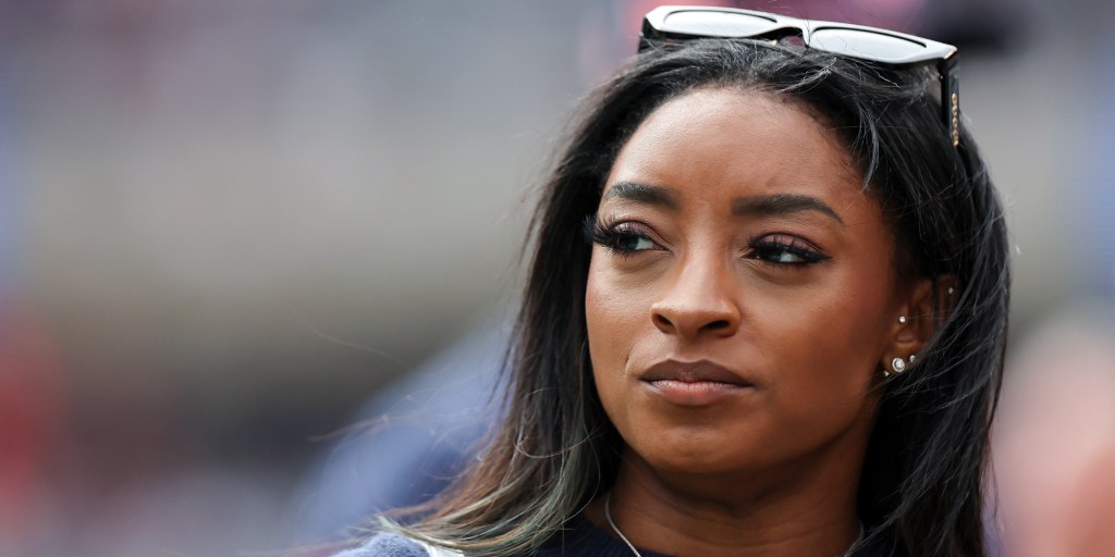 Olympic gold medalist Simone Biles is down one luxury car, she says, and up one security dog after three masked men stole her Porsche GTS.