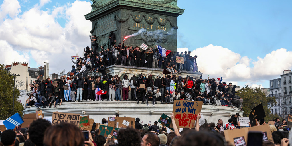 Assembled from plastic garbage bins and metal street debris, makeshift barriers have been erected outside French schools and universities that young protesters are vowing to keep closed until their demands for more education funding are met.