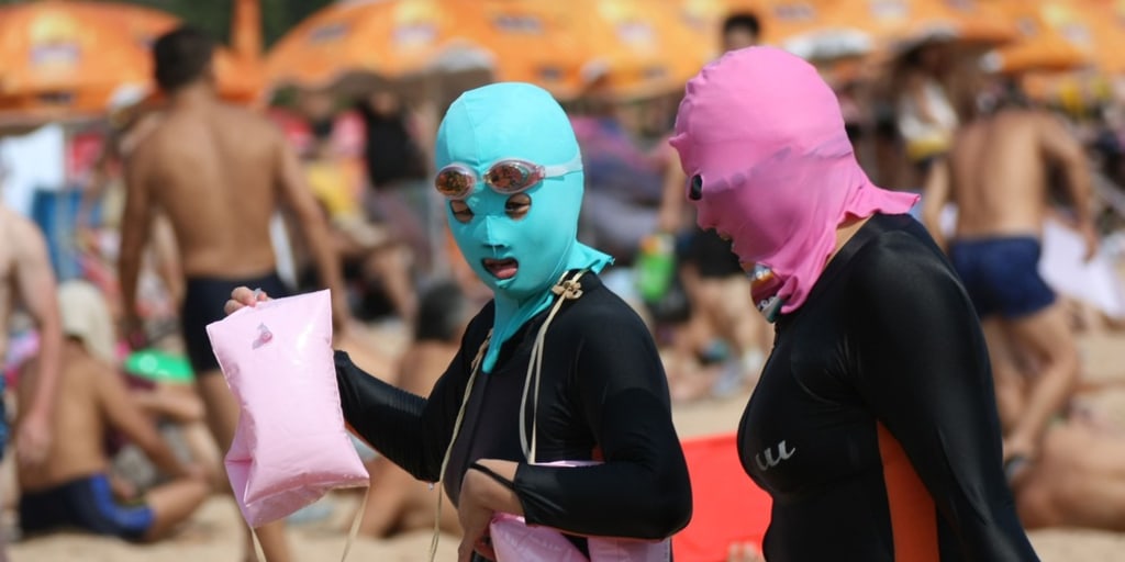 Facekini craze hits China beach as swimmers try to avoid a tan
