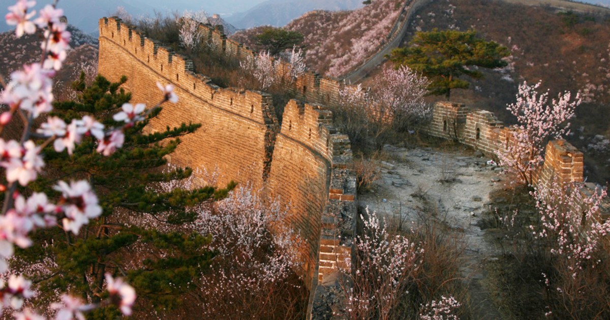 Crumbling Great Chinese Wall running down a hill, Huanghua Great Wall of  China, Great Wall