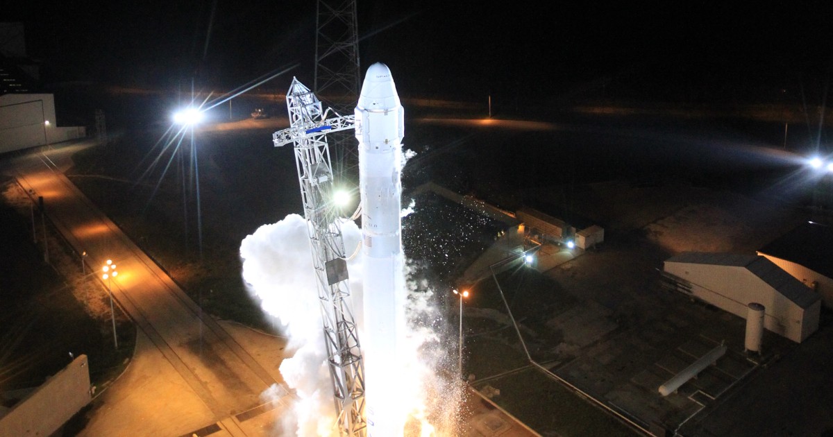 SpaceX capsule chasing space station in orbit