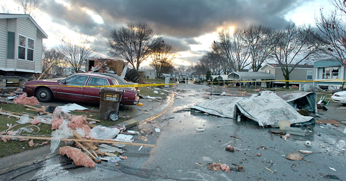 Tornadoes destroy homes, rain floods roads