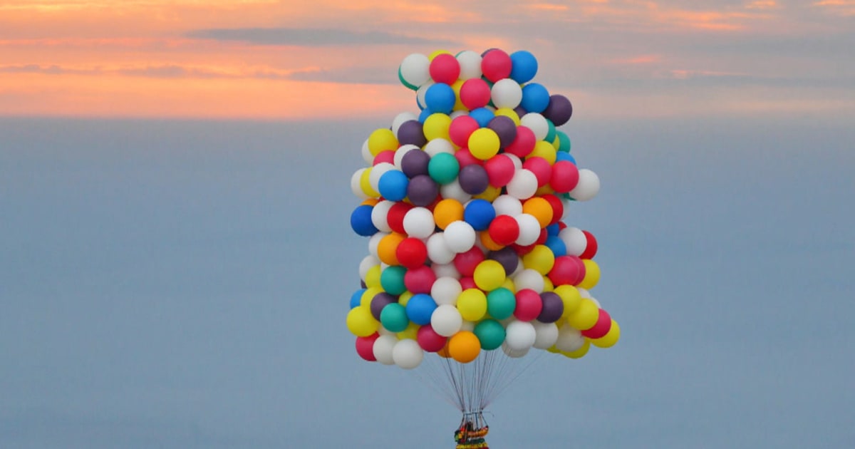 Up, up and away Man tries flying with just balloons