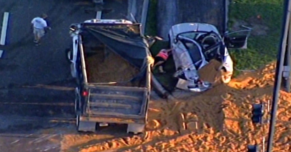 Dump Truck Crash Buries Driver in Sand
