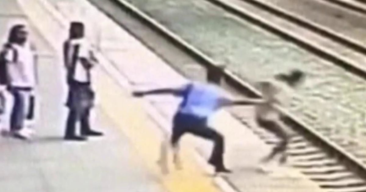 Caught on camera Heroic rail worker saves suicidal woman from jumping