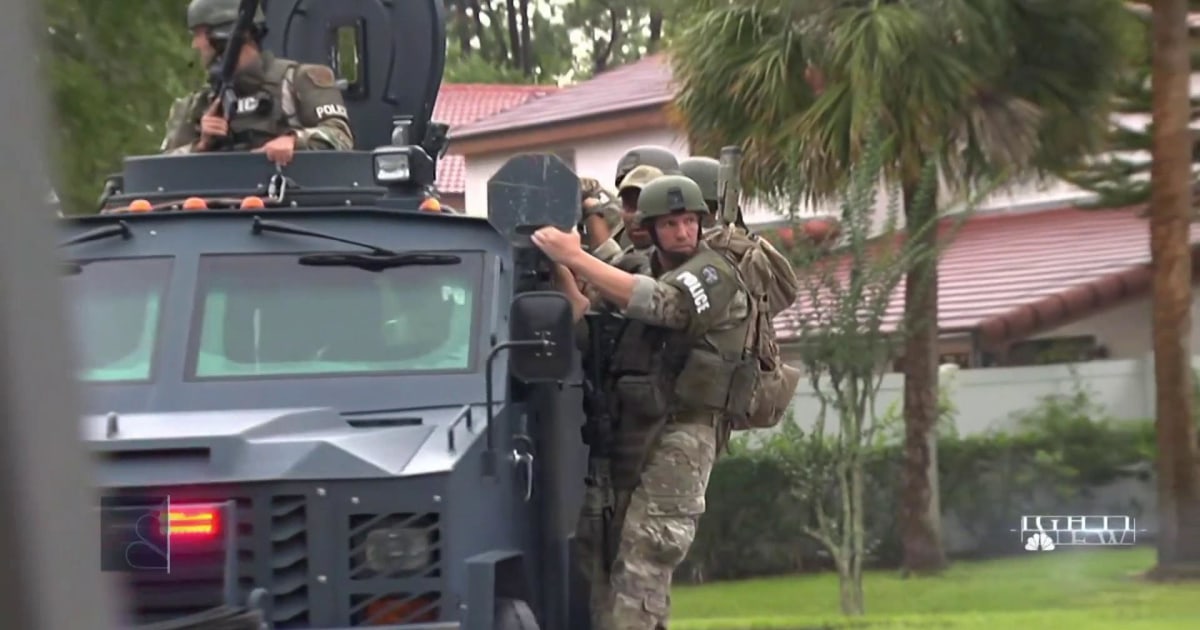 Standoff underway as Florida man shoots officer, holds four children