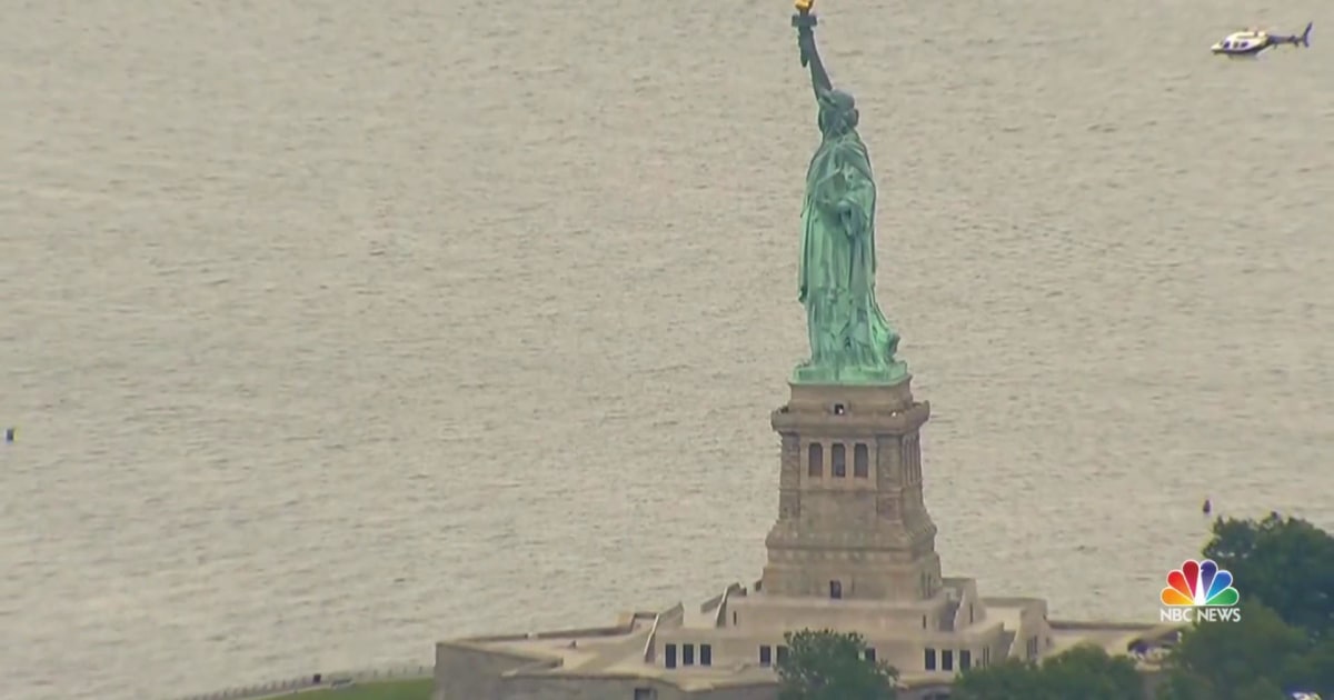 Liberty Island evacuated after woman attempts to scale Statue of Liberty
