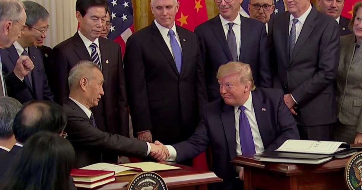 Stocks hit record high as Trump signs China trade deal