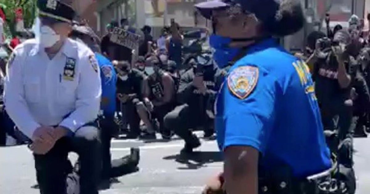 New York police officers prompt cheers as they take the knee with ...