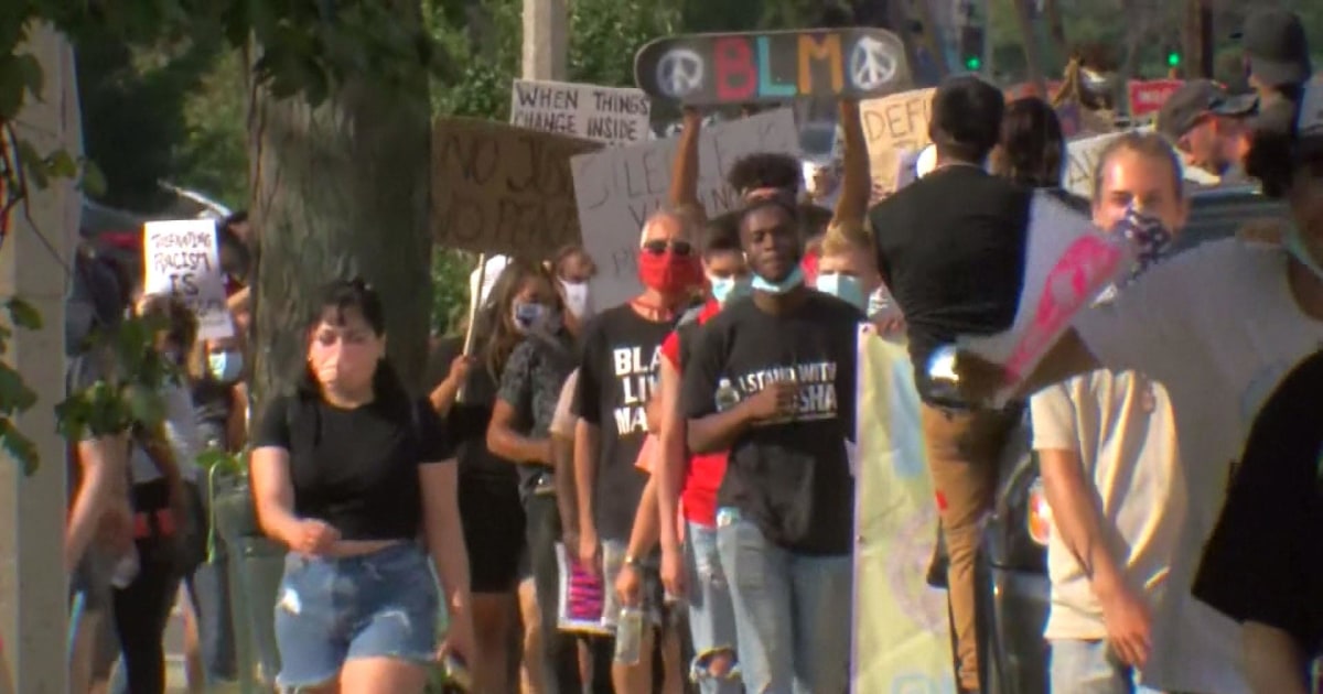 Protesters march through Kenosha, Wis., after a week marked by violence