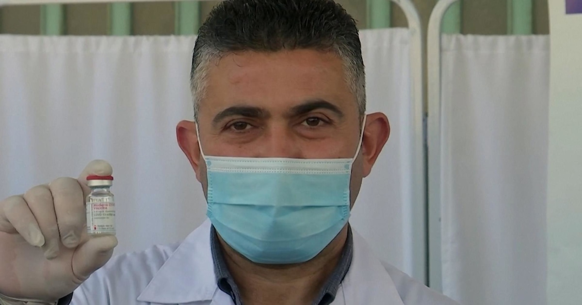 Palestinian healthcare workers react to the status of COVID vaccination