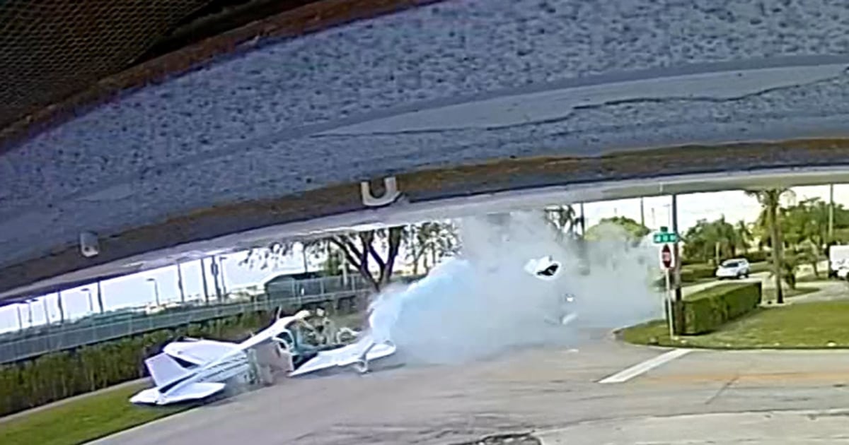 Two people killed when small plane crashes, hits car