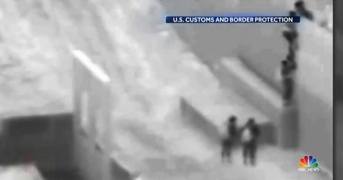 Shocking video shows moment 2-year-old boy dropped over border fence