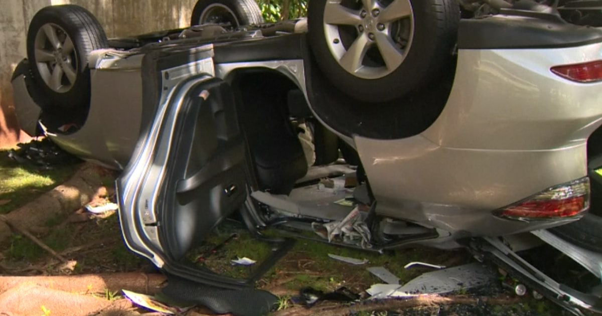 Car Flipped After Elderly Woman Drives off Parking Garage