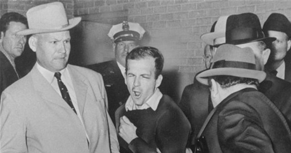 Officer handcuffed to Oswald can't escape photo