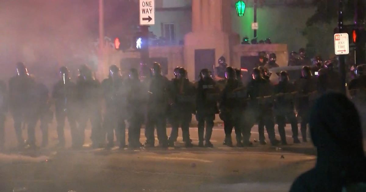 Louisville police officer charged for allegedly striking kneeling protester